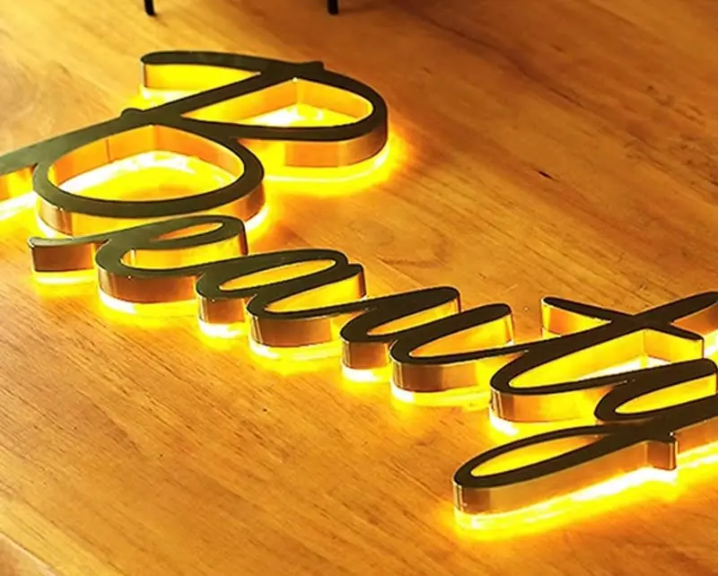 Beauty script sign with warm backlight